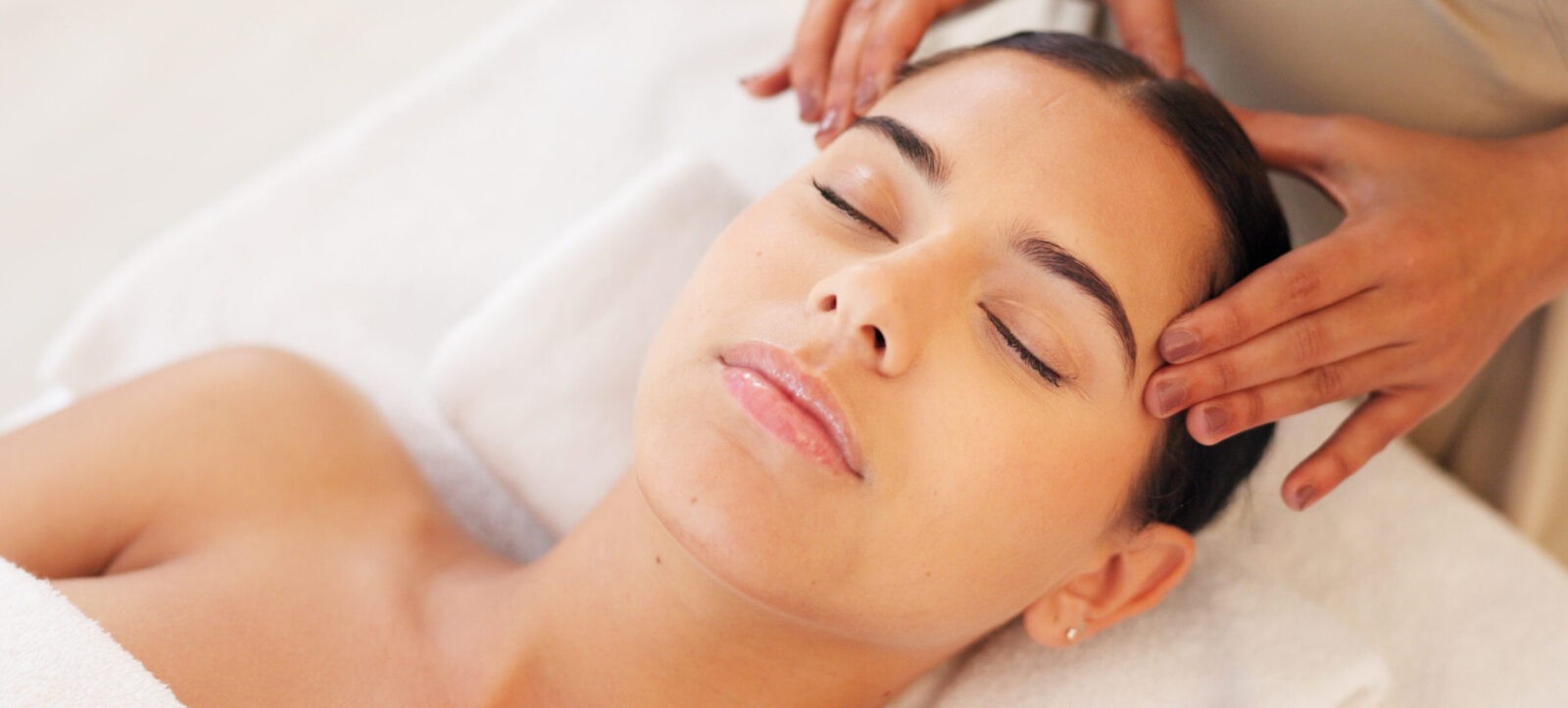 Spa, head massage and calm woman enjoying a relaxing treatment in a wellness, health and beauty center. Relax, peace and therapist doing relaxation therapy for a girl at a luxury natural salon.