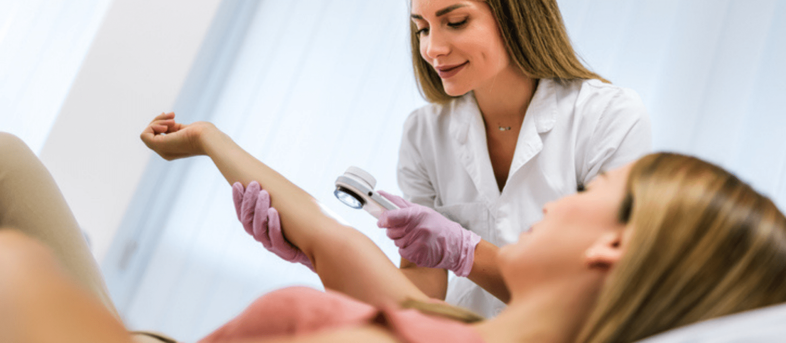 dermatologist looking at a girl's arm